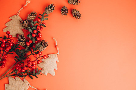 Christmas greeting background with empty space. Brown Christmas trees on a red background. Top viewの写真素材
