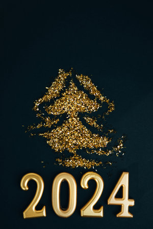 New Year, Christmas background. Golden candles numbers 2024 on a black background with golden...