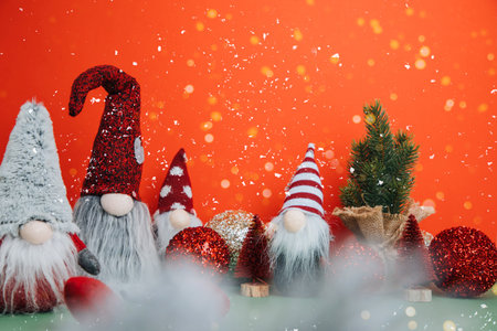 Christmas background for greetings. Christmas trees and gnome on a red-green background. Front viewの写真素材