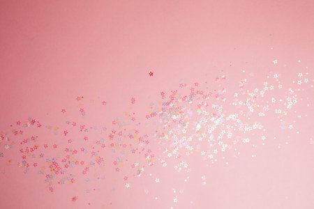 Greeting background with empty space. Pink-blue sparkle sequins, glitter in star shape on a gentle...
