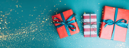 Christmas, festive background. Gifts wrapping in red and brown paper on a blue background. Top view....