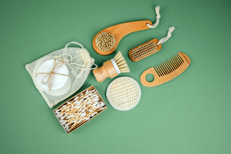 Set eco friendly bath devices. Washcloths, face sponge, ear sticks, wooden brushes and comb on a...