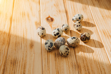 Quail eggs on a wooden background. Happy Easter background. Top viewの写真素材