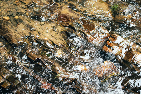 Abstract nature textured background, water waves in the lake with sun reflection, clear transparent...