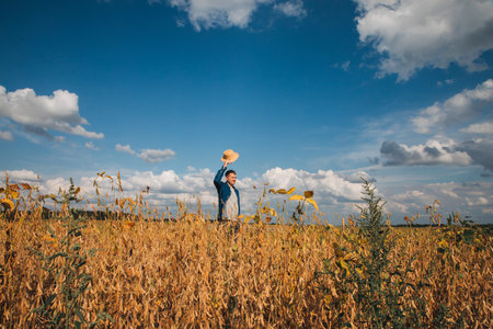 Farmer, agronomist in the soybean field. Controlling the growth of agricultural crops. Green soy...