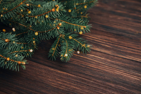 New Year, Christmas background. Branches of a green Christmas tree on a dark wooden background. Top viewの写真素材