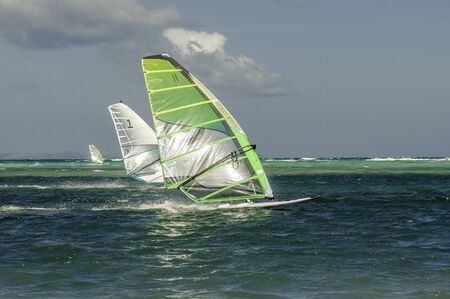 Boracay island, Philippines - January 31, 2015: Windsurfers in windy weathers on The Boracay...