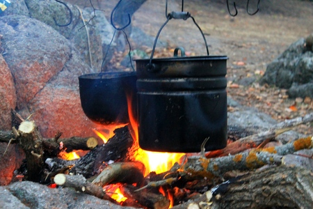 Kettles over the campfireの写真素材