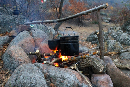 Kettles over the campfireの写真素材