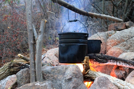 Kettles over the campfireの写真素材