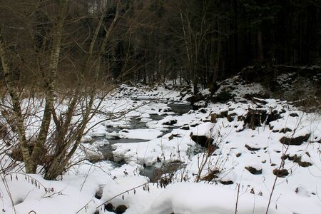 Winter river in Carpathian mountainsの写真素材