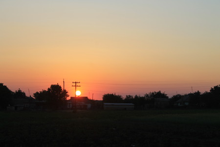 Sunset over villageの写真素材