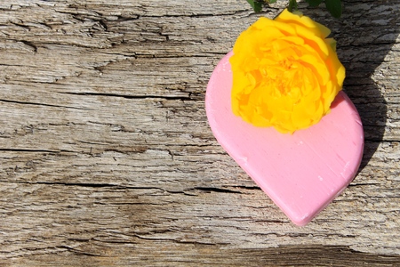 Soap and rose on wooden backgroundの写真素材