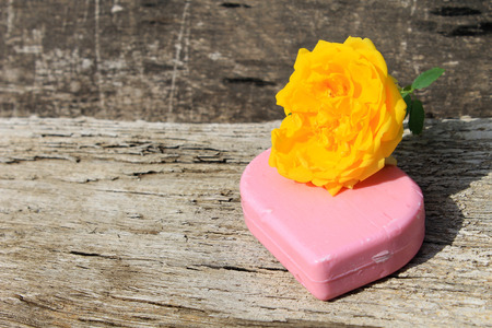 Soap and rose on wooden backgroundの写真素材