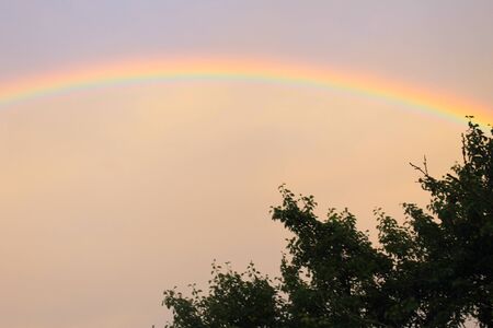 Rural landscape with rainbowの写真素材