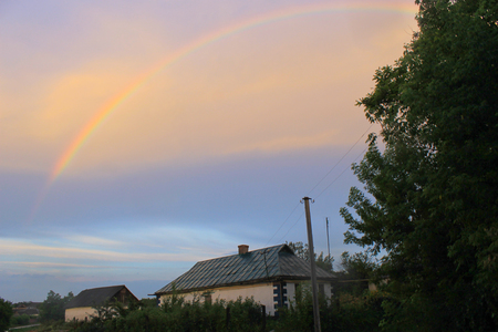 Rural landscape with rainbowの写真素材