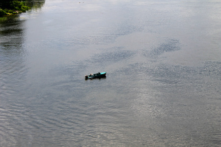 Boat with fishermen at the river Dnieper, Ukraine