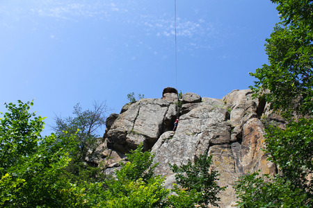 Girl climbing on the rockの写真素材
