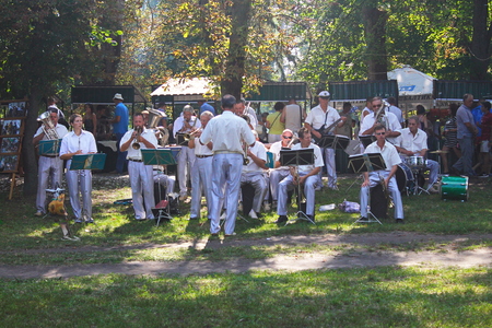 Myrgorod, Ukraine - August 20, 2016: Orchestra performs at festival of blacksmithsのeditorial素材