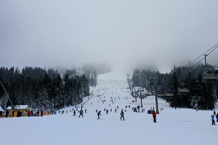 Lviv region, Ukraine - January 9, 2016: Unidentified people skiing and snowboarding in the ski resort Plaiのeditorial素材