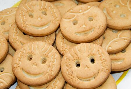 Background of the round smiling  cookiesの写真素材
