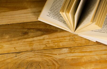 Open book on the wooden deskの写真素材