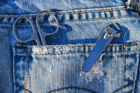 Nail scissors and clippers in the blue jeans pocket
