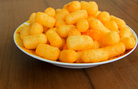 Corn sticks in bowl on the wooden tableの写真素材
