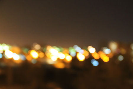 Abstract background of blurred city lights with bokeh effectの写真素材