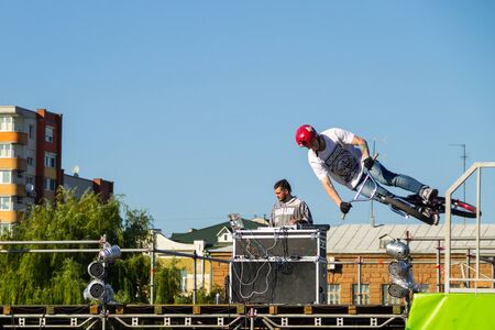 Kremenchug, Ukraine - June 5, 2017:  Extreme BMX rider in helmet in skatepark on competition. Unidentified BMX rider making tricks on festival Extreme zoneのeditorial素材
