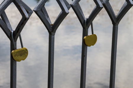 Love lock on the bridge. Symbol of friendship and romanceの写真素材