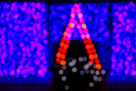 Christmas background. Festive xmas abstract background with bokeh blurred lightsの写真素材