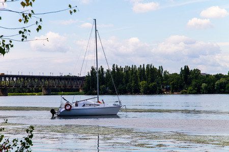 White sailing yacht on the river Dnieperの写真素材