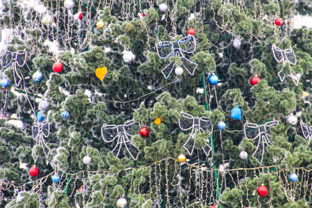 Christmas decorations on the Christmas tree covered with rime
