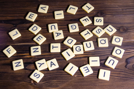 Many letters on wooden backgroundの写真素材