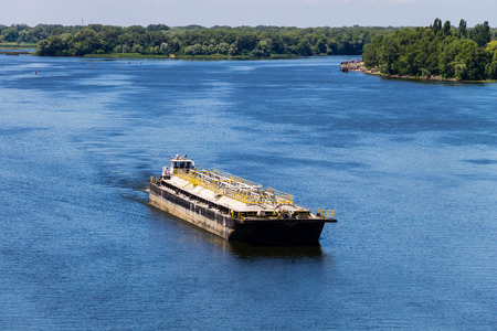 Barge floating on the Dnieper river in Ukraineの写真素材
