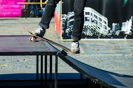 Skateboarder legs riding skateboard at skateparkの写真素材