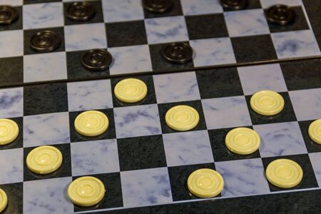Checkerboard with checkers. Draughts on playing field. Game concept. Board gameの写真素材