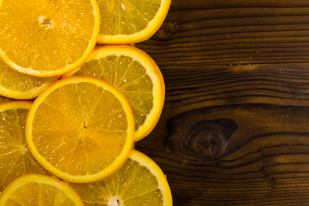 Sliced oranges on wooden table. Top view, copy spaceの写真素材