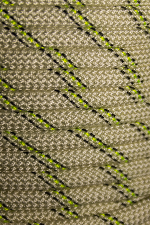 Close-up of coiled sport climbing rope. Hiking equipment tightrope