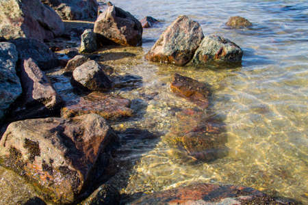 Sea waves splashing over rocks