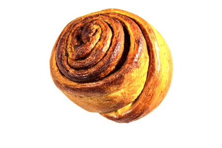 Sweet cinnamon bun isolated on white backgroundの写真素材