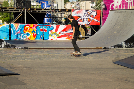 Kremenchug, Ukraine - June 5, 2017: Skateboarder doing a trick in a skate park on youth festival Extreme zoneのeditorial素材