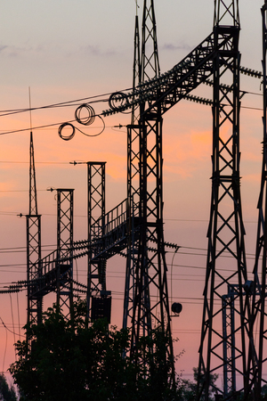 High voltage power plant at sunsetの写真素材