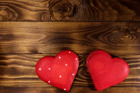 Heart shaped cookies for valentine day on wooden table. Top view, copy spaceの写真素材