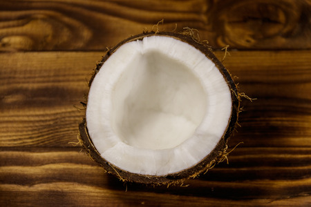 Fresh ripe coconut on rustic wooden tableの写真素材