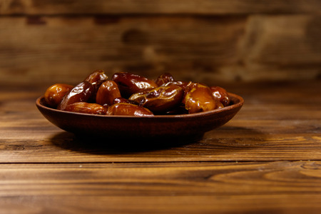 Dried dates fruit on wooden tableの写真素材