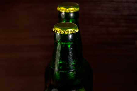 Two bottles of beer on wooden tableの写真素材
