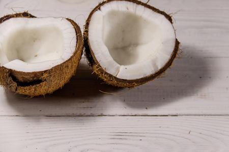 Fresh ripe coconut on white wooden tableの写真素材