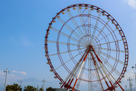 Ferris wheel on embankment of Batumi at sunny dayの写真素材